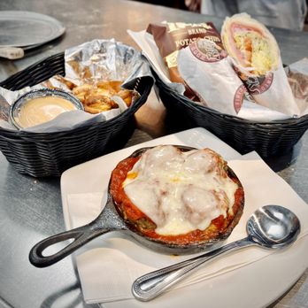 Billy Bricks - Oak Park - a plate of food on a table - Pizza Near Me - Oak Park, Illinois Billy Bricks - Oak Park - a plate of food on a table - Pizza Near Me - Oak Park, Illinois