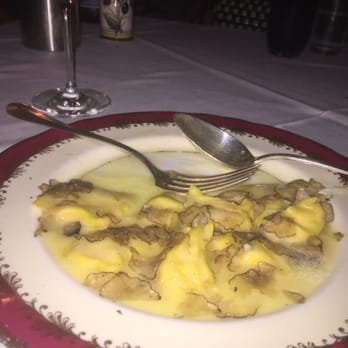 Capo - Half consumed white corn ravioli with shaved black truffles in a light butter sauce. Divine! - Italian Near Me - Santa Monica, California
