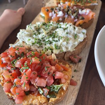 Postino East - Bruschetta (almond hummus, artichoke, salmon, tomato jam and goat cheese) - Wine Bars Near Me - Gilbert, Arizona Postino East - Bruschetta (almond hummus, artichoke, salmon, tomato jam and goat cheese) - Wine Bars Near Me - Gilbert, Arizona