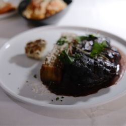 Crossroads Kitchen - Lions mane steak made from potato's and mushroom.