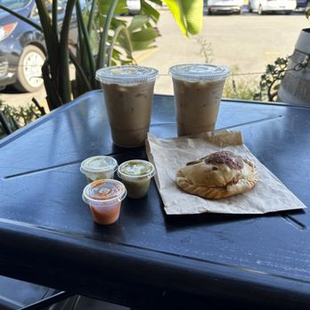 Venus - 2 Churro Lattes, chorizo empanada, herb sauce, chimichurri sauce, and habanero sauce - Coffee & Tea Near Me - Sacramento, California