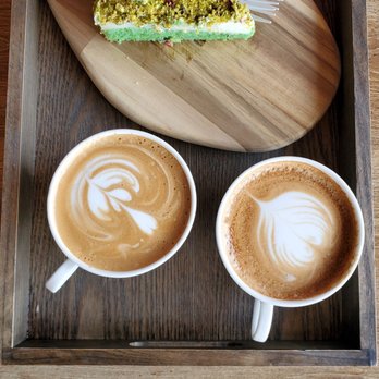 Finjan Cafe - Pistachio rose cake with capuchino and latte  Ask 'for here ' to get plating and stuff - Coffee & Tea Near Me - Garden City, Michigan