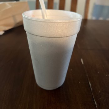 Gyro Shack - Nice size to. Make sure to try it out.  Frozen cherry yogurt - A foam cup containing frozen cherry yogurt with a straw, placed on a wooden table in a casual setting. - Mediterranean Near Me - Joliet, Illinois