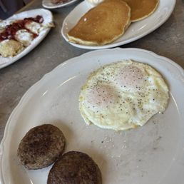 My sausage and egg breakfast with pancakes. My sausage and egg breakfast with pancakes.