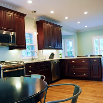 Stafford Construction - a kitchen with a table and chairs - General Contractors Near Me Stafford Construction - a kitchen with a table and chairs - General Contractors Near Me