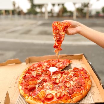 Pizza Guys - a hand holding a slice of pizza - Pizza Near Me - San Jose, California Pizza Guys - a hand holding a slice of pizza - Pizza Near Me - San Jose, California