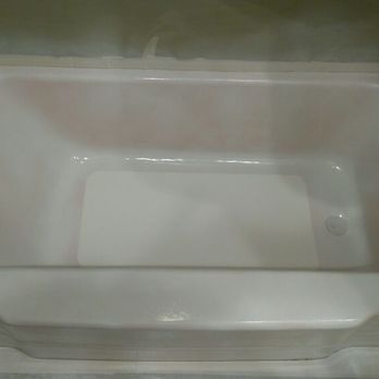 Bathtub Refinished - At this stage the adhesion promoter primer, non slip texture and first coat of white finish has been applied. - Refinishing Services Near Me
