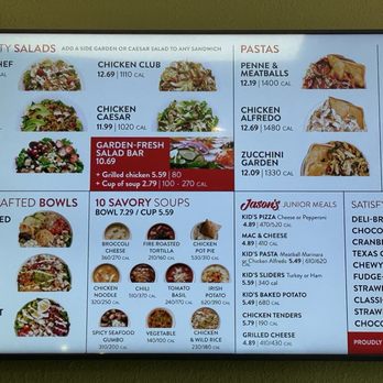 Jason's Deli - The image shows a digital menu board at Jason's Deli in Albuquerque, NM, featuring sections for salads, pastas, soups, bowls, and desserts. The salads include options like The Big Chef and Chicken Caesar, with a Garden-Fresh Salad Bar promotion. Pastas include Penne & Meatballs and Chicken Alfredo. Soups are listed with prices and calorie counts, such as Broccoli Cheese and Chicken Pot Pie. Bowls include Modern Med and Great Southwest. The desserts section lists items like cookies, chocolate chip cookies, and strawberry shortcake. The menu provides detailed pricing and calorie information for each item. - Delis Near Me - Albuquerque, New Mexico