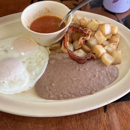 Huevos Rancheros w/Bacon and sauce on the side Huevos Rancheros w/Bacon and sauce on the side