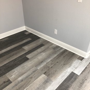 Nick and Sons Construction - a hardwood floor in a room - Flooring Near Me Nick and Sons Construction - a hardwood floor in a room - Flooring Near Me