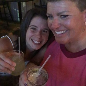 Union Street Station - a woman and a woman holding drinks - Music Venues Near Me - Traverse City, Michigan