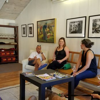 Chesebro Wines - a group of people sitting around a table - Wine Tasting Room Near Me - Carmel Valley, California