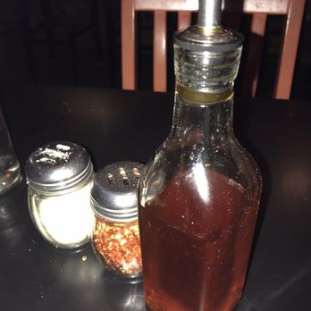 Colorado Boy Pub & Brewery - Their homemade garlic chili oil. So good! You can also buy a small bottle for $10 and they will refill it for $7. - Pizza Near Me - Ridgway, Colorado Colorado Boy Pub & Brewery - Their homemade garlic chili oil. So good! You can also buy a small bottle for $10 and they will refill it for $7. - Pizza Near Me - Ridgway, Colorado