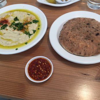 Aviv Hummus Bar - masabacha ($12) with pita and s'chug, a solid hot sauce - Falafel Near Me - Seattle, Washington Aviv Hummus Bar - masabacha ($12) with pita and s'chug, a solid hot sauce - Falafel Near Me - Seattle, Washington