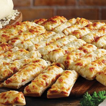 Pizza Delight - a sliced pizza with cheese and garlic - Pizza Near Me - Fergus, Ontario Pizza Delight - a sliced pizza with cheese and garlic - Pizza Near Me - Fergus, Ontario