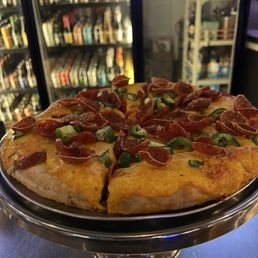 Original pizza with pepperoni and jalapenos. Original pizza with pepperoni and jalapenos.