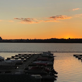 Storm Shelter - a sunset over a dock with boats - Bars Near Me - East Peoria, Illinois Storm Shelter - a sunset over a dock with boats - Bars Near Me - East Peoria, Illinois
