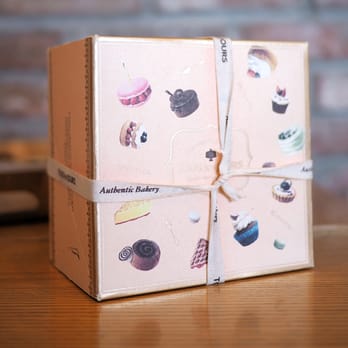 Tous Les Jours - Only one in store for now so box and white ribbon not available. They have green box also brown and green ribbons available. - Bakeries Near Me - Dublin, California