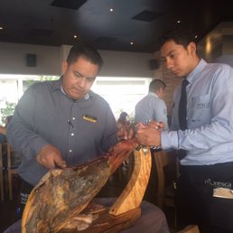 Clemente slices the Jamon Serrano "Pata Negra" with care. Clemente slices the Jamon Serrano "Pata Negra" with care.