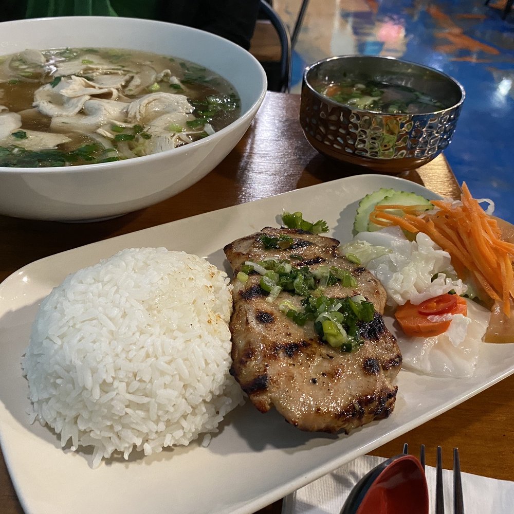 Newton Pho - Notice how large the XL pho is vs a standard soup bowl and pork chop. - Vietnamese Near Me - Tucson, Arizona Newton Pho - Notice how large the XL pho is vs a standard soup bowl and pork chop. - Vietnamese Near Me - Tucson, Arizona