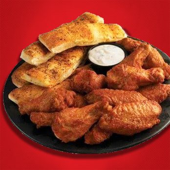 Hungry Howie's Pizza & Subs - a plate of chicken wings with dipping sauce - Pizza Near Me - Oviedo, Florida Hungry Howie's Pizza & Subs - a plate of chicken wings with dipping sauce - Pizza Near Me - Oviedo, Florida