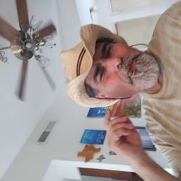C-Mart - a man wearing a hat and pointing at something - food - Convenience Stores Near Me - Austin, Texas