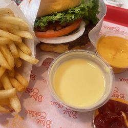 Cheeseburger meal with cheese on the side and Boom Boom special sauce