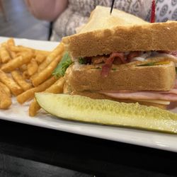 The Office Bar & Grille - The Club Sandwich with fries.