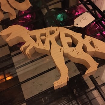 Uncommon Ground - a wooden dinosaur on a shelf - Coffee & Tea Near Me - Medford, Wisconsin Uncommon Ground - a wooden dinosaur on a shelf - Coffee & Tea Near Me - Medford, Wisconsin
