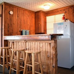 Cedar Lodge - Image of our rustic cabin interior. All cabins include a kitchenette and modern-day appliances.