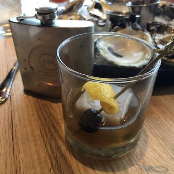 Tricky Fish - They make a great Manhattan (with a dozen oysters in the background). - Seafood Near Me - Fort Worth, Texas Tricky Fish - They make a great Manhattan (with a dozen oysters in the background). - Seafood Near Me - Fort Worth, Texas