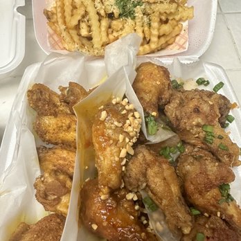 Fire Wings - Clockwise: garlic fries, Saigon street, peanut butter, Malaysian curry rub - Chicken Wings Near Me - Long Beach, California Fire Wings - Clockwise: garlic fries, Saigon street, peanut butter, Malaysian curry rub - Chicken Wings Near Me - Long Beach, California