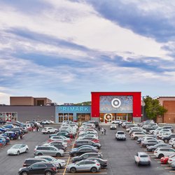 Exterior view of Target, Primark and Barnes & Noble with a busy parking lot at Danbury Fair.
