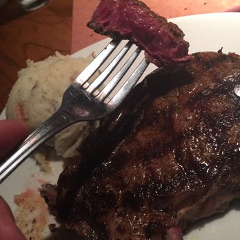 Outback Steakhouse - Look. At. That. Why would you want to spoil it? I'd probably cook a bit more, just to heat the center more, but not all the way to medium. - Steakhouses Near Me - Miami, Florida