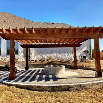 Legacy Landscapes - Leveled-out area with small wall, paver patio, firepit and cedar pergola - Landscaping Near Me Legacy Landscapes - Leveled-out area with small wall, paver patio, firepit and cedar pergola - Landscaping Near Me