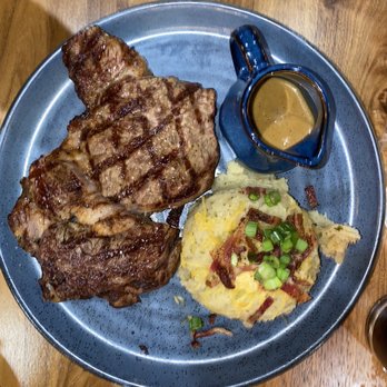 Crave Kitchen & Bar - Ribeye with loaded smashed potatoes - Bars Near Me - Eagle, Idaho