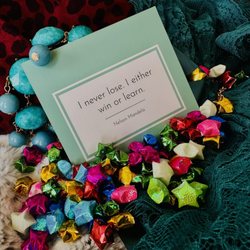 Jezebel Vonzephyr Boudoir - The quote card surrounded by choice fabrics/props from the photoshoot