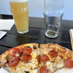 Good News Brewing - Meat pizza and Local 636 Hazy IPA. And an empty Dirty Laundry Brown Ale next to it