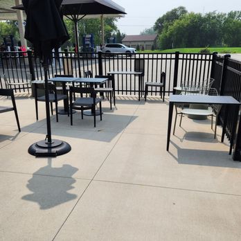 Starbucks - a patio with tables and umbrellas - Coffee & Tea Near Me - Walker, Michigan