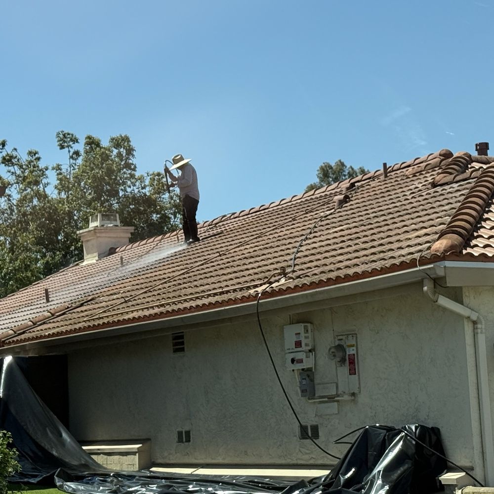 Power washing the old tile after the job was done!