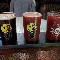 Three flight-sized pours of various beers. Three flight-sized pours of various beers.