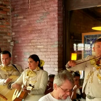 Olvera Street - Mariachi serenading the public. - Local Flavor Near Me - Los Angeles, California Olvera Street - Mariachi serenading the public. - Local Flavor Near Me - Los Angeles, California