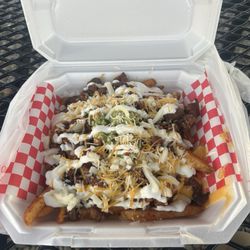 El Meson - Loaded fries with marinated pork.