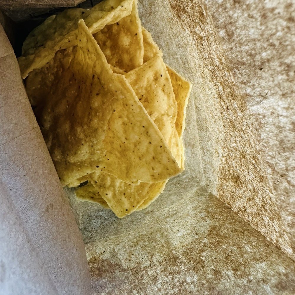 Dos Batos - Chips inside small brown bag - Tacos Near Me - Austin, Texas