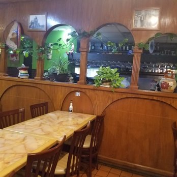 Los Laureles - a dining area with tables and chairs - Mexican Near Me - Des Moines, Iowa Los Laureles - a dining area with tables and chairs - Mexican Near Me - Des Moines, Iowa