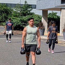 Crossfit Secaucus - Gonzalo farmer's walking during a Saturday 10 a.m. group class at CrossFit Secaucus, Hudson County, NJ.