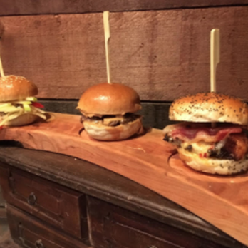 Walkerville Eatery - three burgers on a wooden board - Pizza Near Me - Windsor, Ontario