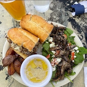 Blue Moon Cafe - Savory tender beef & brie sandwich with bright horseradish mayo, and a generous grilled portabella side-salad and roasted potatoes - Cafes Near Me - Shepherdstown, West Virginia