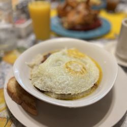 Betty’s - Grits with corned beef hash topped with two eggs.