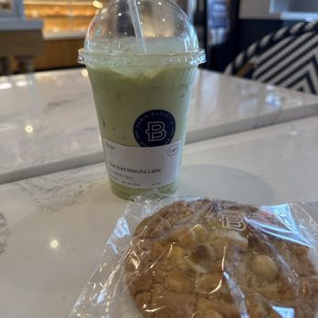 Paris Baguette - pistachio oat milk Iced Matcha Latte with a white chocolate Macadamia Nut Cookie - Bakeries Near Me - Winter Park, Florida